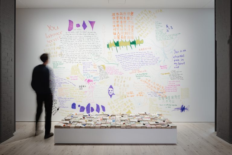 Figure 11:8. Liu Chuang, Love Story, 2014, found books, coloured stones, and inscriptions on wall, dimensions variable, image courtesy of Liu Chuang and White Rabbit Collection, Sydney.  Photography: Hamish MacIntosh.