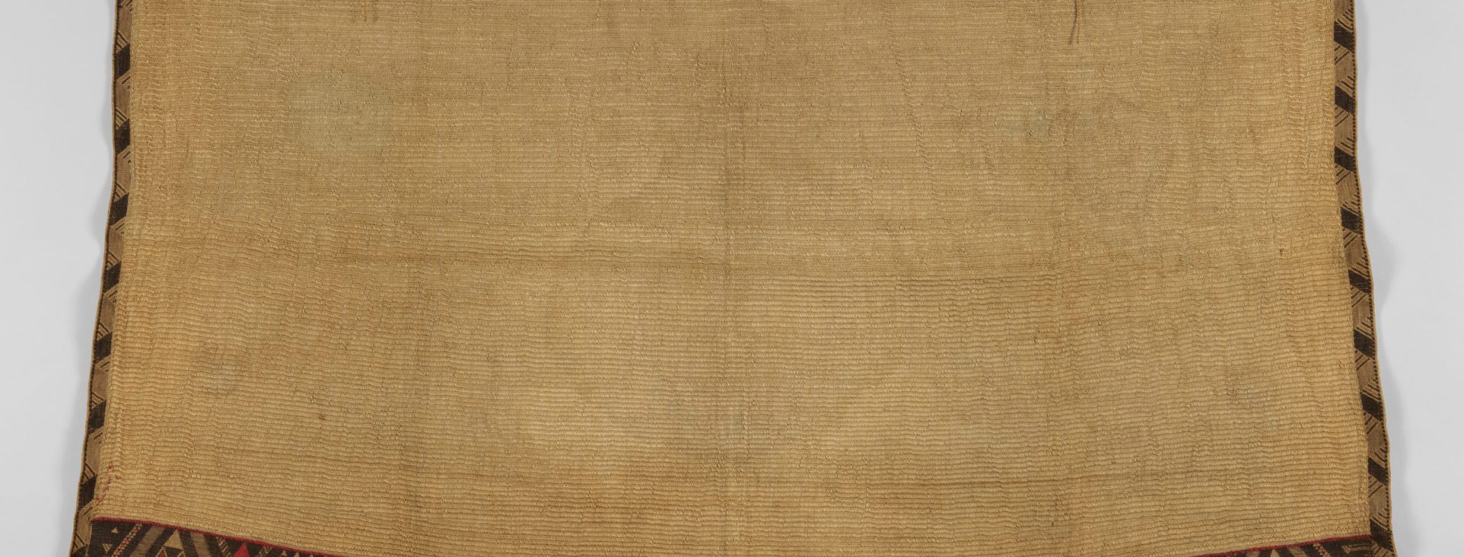 Figure 9:9. Aotearoa New Zealand Māori people,  Kaitaka aronui, cloak, mid-19th century, flax, wool, 113.7 × 172.7 cm, The Metropolitan Museum of Art, New York City.